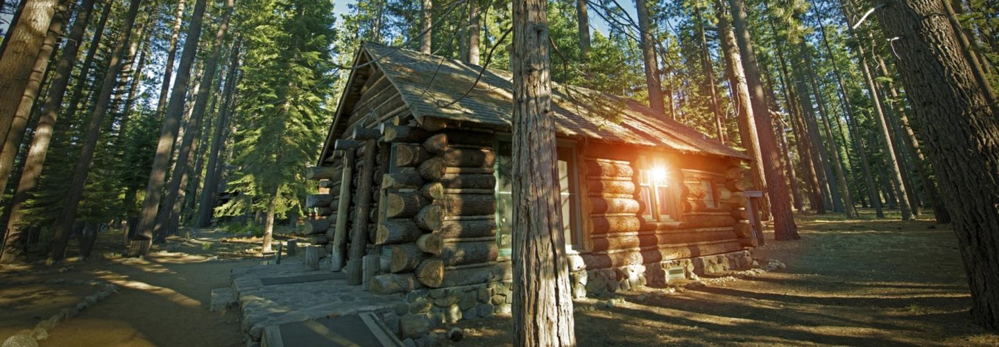 Aged Forest Log Cabin Somewhere in Sierra Nevada Mountains, United States.